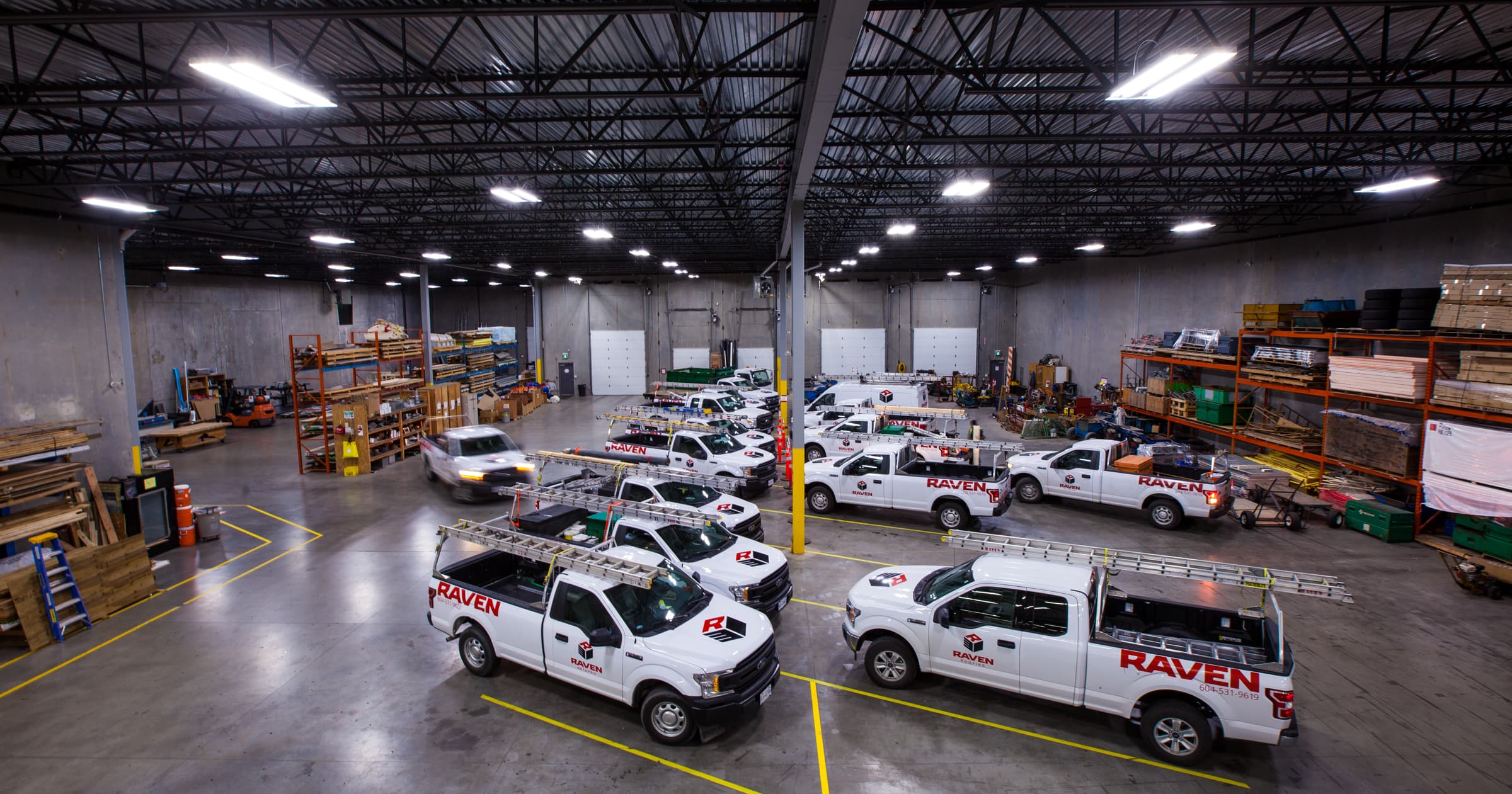 Raven Roofing warehouse and fleet